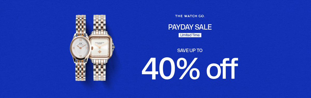 Spanduk promosi Payday Sale The Watch Co dengan diskon hingga 40 persen menampilkan dua jam tangan wanita dengan tali logam